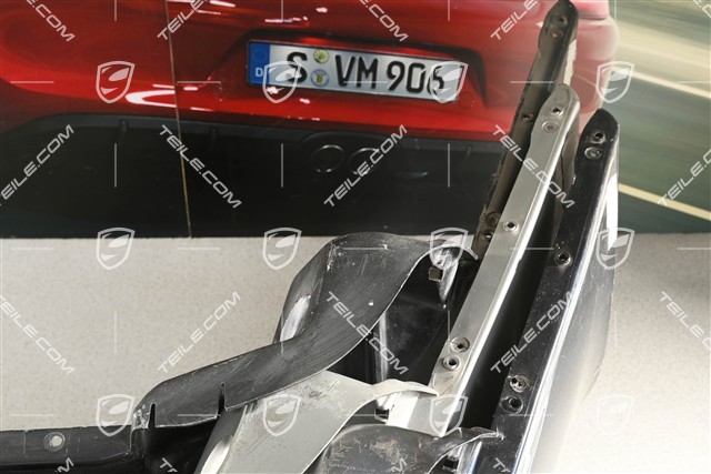 Rear bumper, damaged, with cracks and small bumps